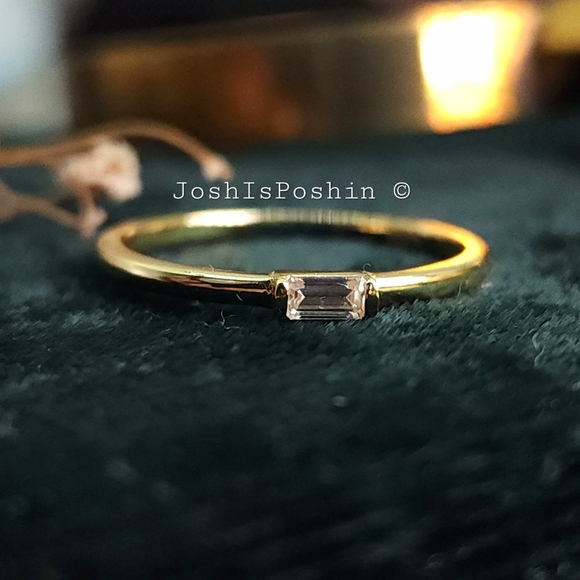 Bezel set emerald cut moissanite in 18k gold over sterling silver